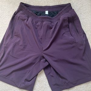 Men’s Lululemon Pacebreaker Shorts, 9” lined, color is Black Cherry